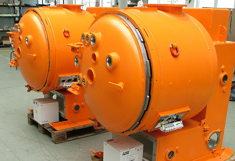 Orange switchboard components in the production hall